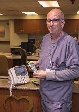 Doug Flynn, PCT, demonstrates the new communication system in the PCU.