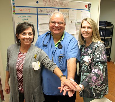 Dosher Patient Care Director JoAnn Turzer-Commesso, RN, Hospitalist Dr. Raymond Schmoke, and Case Manager Ava McDonald are proud of staff teamwork that led to low readmission rates for pneumonia and heart failure patients.