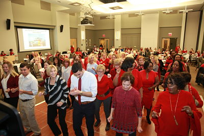 More than 50 guests participate in a line dance exercise at Dosher Foundation's Heart to Heart women's heart health event on February 8.