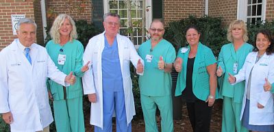 Seven members of the Dosher Wound Care staff are all smiles after the unit was recertified as a national Center of Excellence for wound healing.