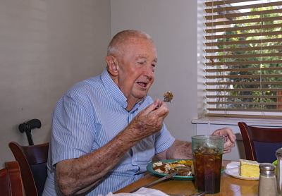 Wound Care Center patient Elmer Safrit asks to be shown eating, which he can do once again after successful HBO treatments at Dosher.