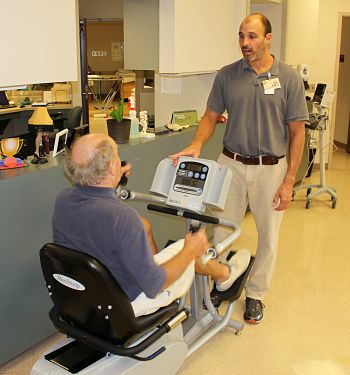 Pat Dane tells licensed physical therapist assistant Mark H. that cycling has been the most helpful exercise to recover from three joint replacement surgeries.