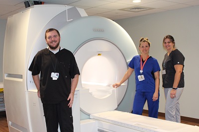 Posing with Dosher&#x2019;s wide bore MRI are our MRI Technologists, (L &#x2013; R): Michael Earp, Adrienne Rauccio, and Michelle Rogers